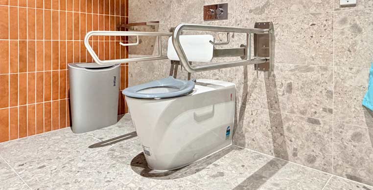 Changing Places facilities provide secure, suitable facilities for people who cannot use standard accessible toilets. This image features one of these toilets. 
